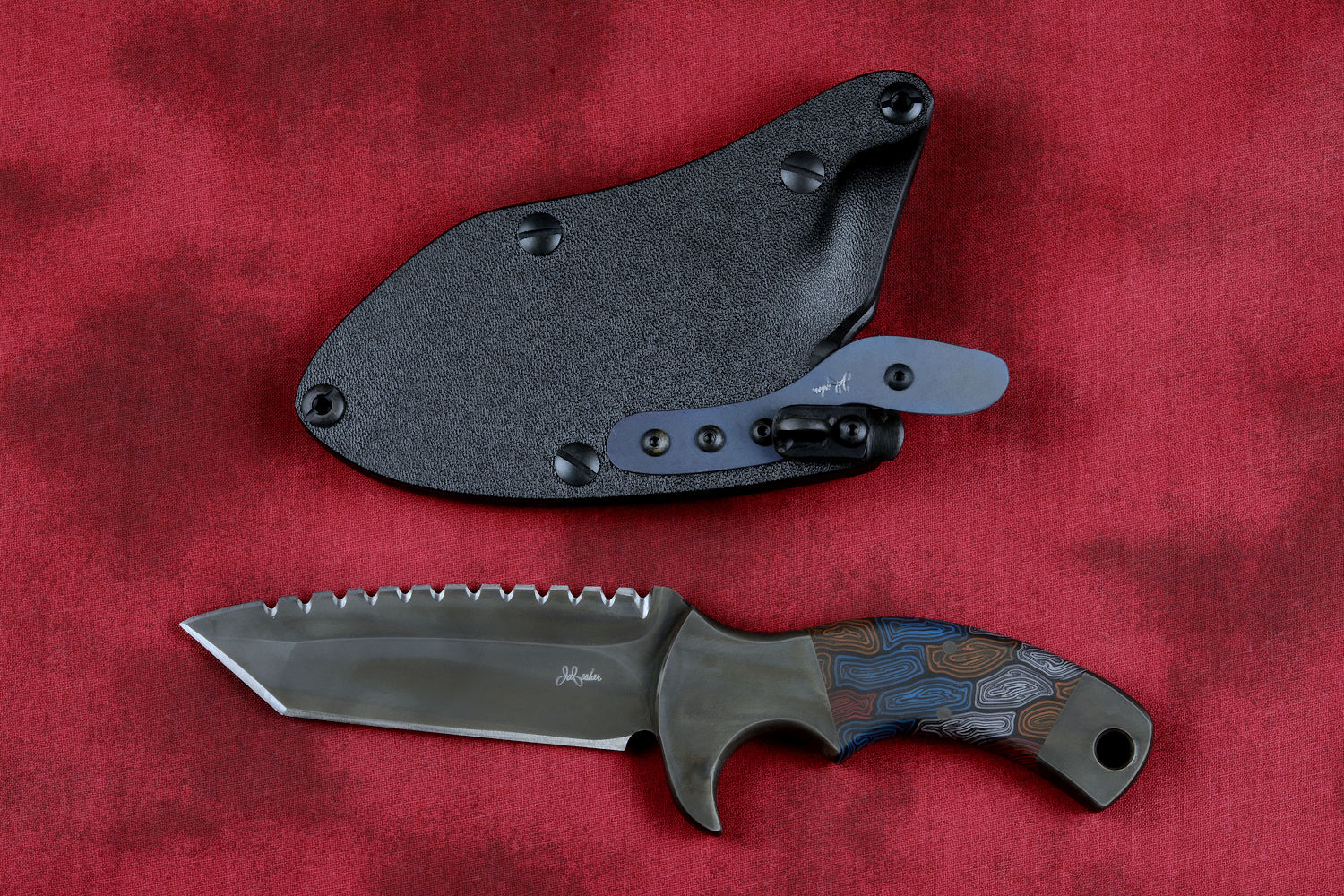 "Krag" tactical, counterterrorism, crossover knife, obverse side view in ATS-34 high molybdenum martensitic stainless steel blade, 304 stainless steel bolsters, multicolored tortoiseshell  G10 fiberglass/epoxy composite handle, hybrid tension tab-locking sheath in kydex, anodized aluminum, black oxide stainless steel and anodized titanium