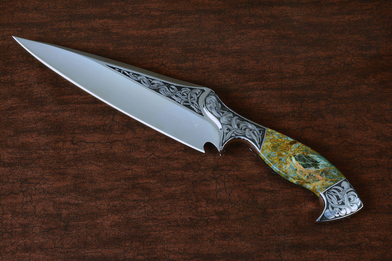 "Malaka" fine custom handmade knife in hand-engraved CPM 154CM powder metal technology stainless steel, T4 deep cryogenically treated, bolsters of hand-engraved 304 stainless steel, Plasma agate and Nephrite Jade gemstone handle, hand-carved leather crossdraw sheath with stainless steel hardware
